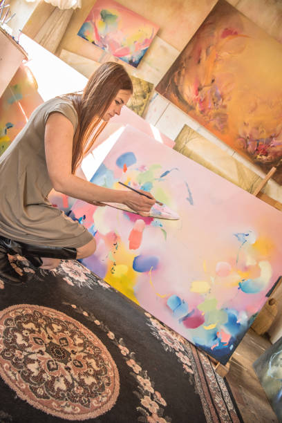 istock Woman Painter Mixing Oil Paints on Palette 1202055391
