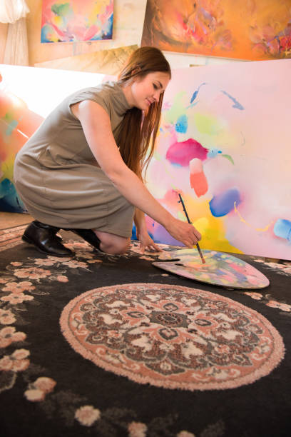 istock Woman Painter Mixing Oil Paints on Palette 1202055401