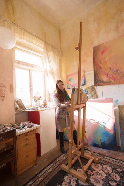 istock Woman Painting in her Creative Corner 1202055466