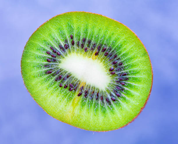 istock Kiwi fruit. A piece is shot close-up macro shot 1202056660
