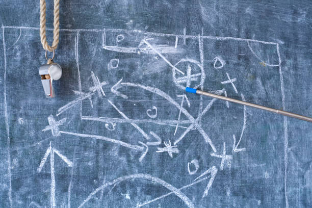 istock Soccer or football tactics scribble with the trainers whistle and pointer stick on blackboard. Great soccer event in europe. 1202056883