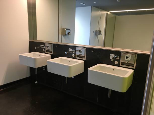 istock toilets in a public toilet 1202061097