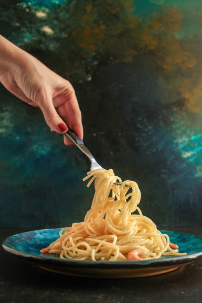 istock pasta prawn (spaghetti shrimp cream sauce and seafood ) menu concept. food background. top view. copy space 1202062594