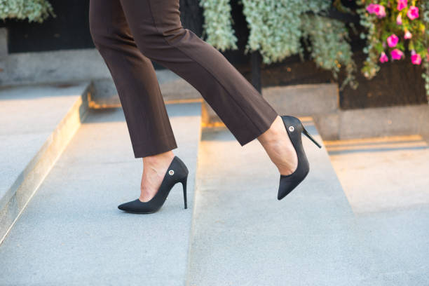 istock Businesswoman walking on the staircase 1202070198