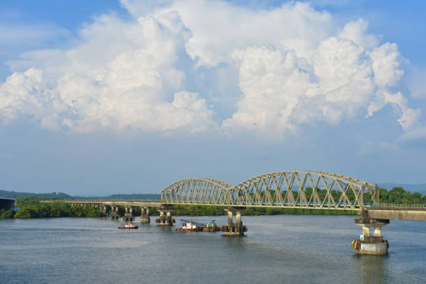 istock Beautiful clouds with a connecting bridge over a river 1202070303