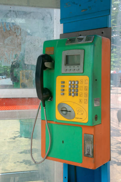 istock Old classic public telephone booth machine 1202071235