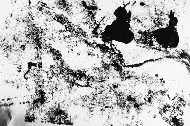 istock Patterns of black paint from a brush on a white background 1202071932