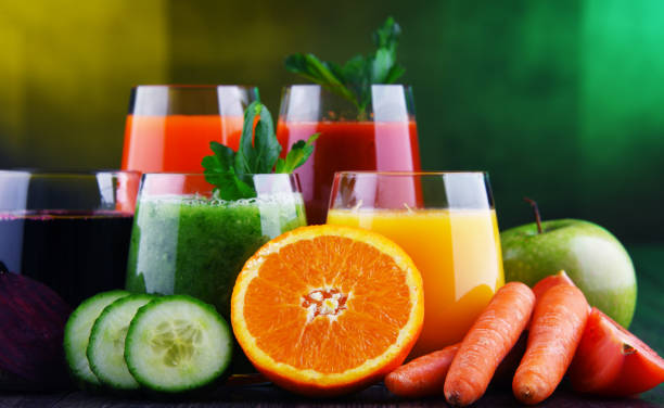 istock Glasses with fresh organic vegetable and fruit juices 1202072219