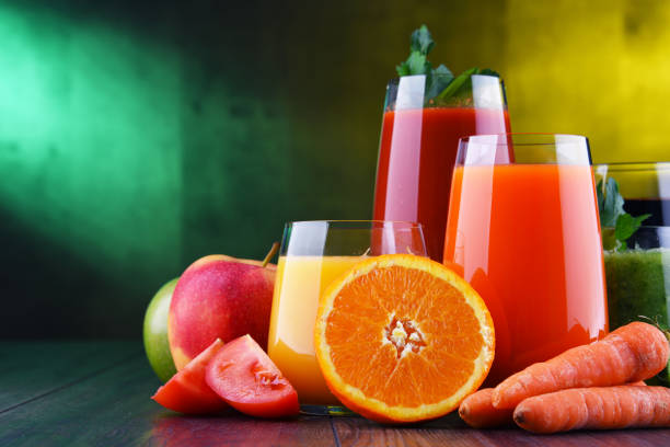 istock Glasses with fresh organic vegetable and fruit juices 1202072731