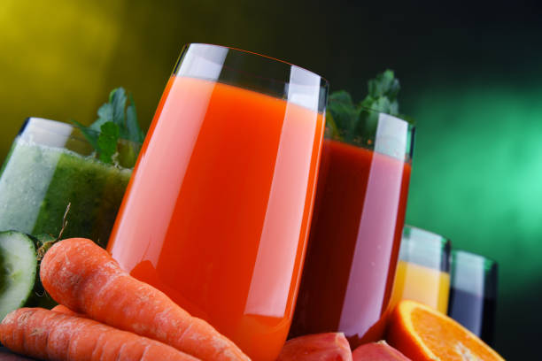 istock Glasses with fresh organic vegetable and fruit juices 1202072744