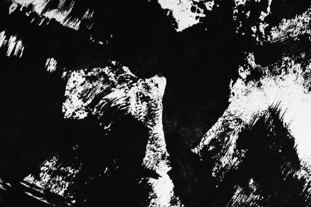 istock Patterns of black paint from a brush on a white background 1202072755