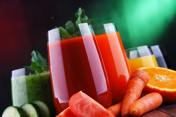 istock Glasses with fresh organic vegetable and fruit juices 1202072776