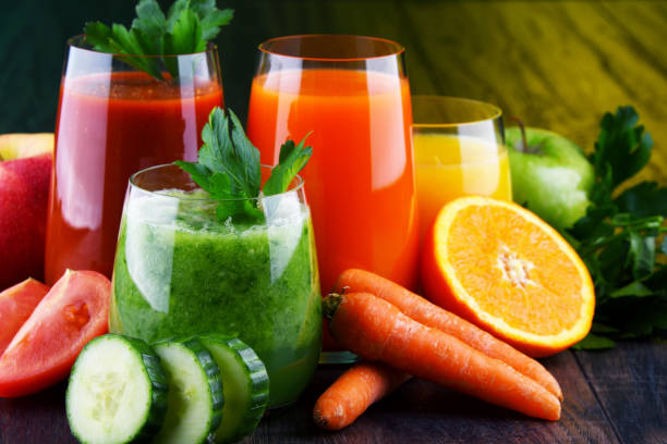 istock Glasses with fresh organic vegetable and fruit juices 1202072783