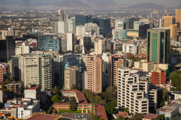 Mexico city DF aerial view with mountains and clouds