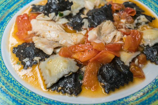 istock Delicious fish ravioli pasta with tomato sauce. 1202075585