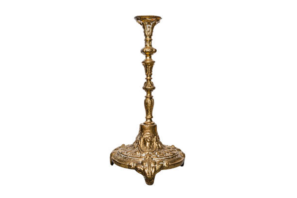 istock Single arm candlestick made of brass made in old decorative style, isolated on a white background with a clipping path. 1202076737