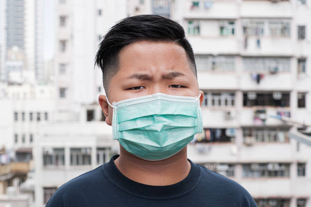 istock Asian young kid wearing a mask 1202079793