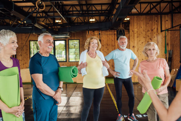istock Happy seniors starting a group yoga class 1202081899