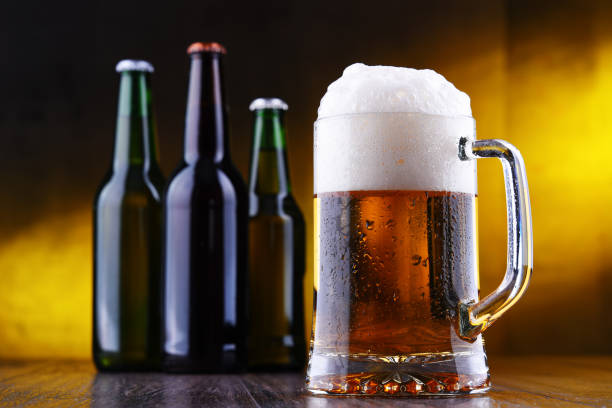istock Composition with glass and bottles of beer 1202082836