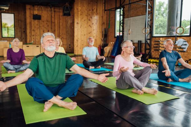 istock Group of seniors staying active with yoga 1202082842