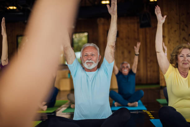 istock Group of seniors staying active with yoga 1202082849