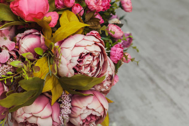istock Paper and textile artificial flowers in a decorative bouquet. 1202082987