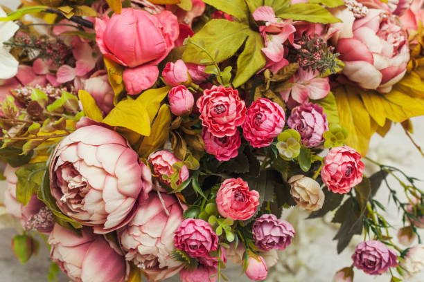 istock Paper and textile artificial flowers in a decorative bouquet. 1202083020