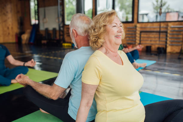 istock Group of seniors staying active with yoga 1202083395