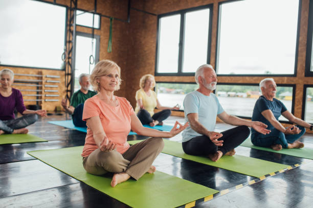 istock Group of seniors staying active with yoga 1202083396