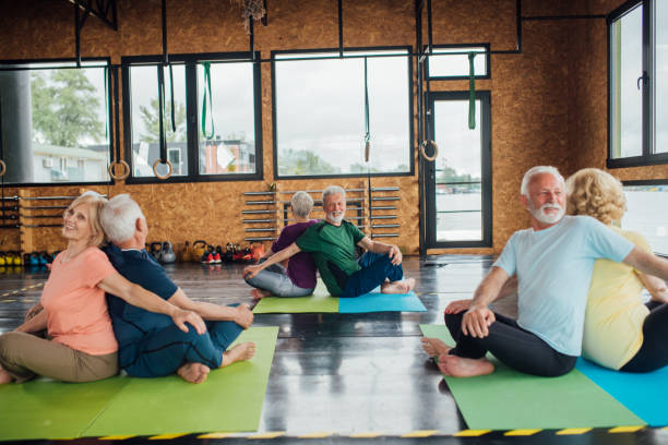 istock Group of seniors staying active with yoga 1202083397
