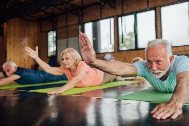 istock Group of seniors staying active with yoga 1202083401