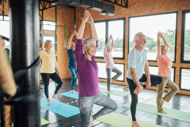istock Group of seniors staying active with yoga 1202083413