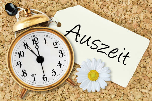 istock Alarm clock five minutes to twelve and German: Timeout 1202087193