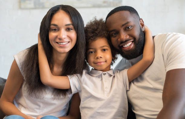 istock Little son is hugging his father and mother 1202088238