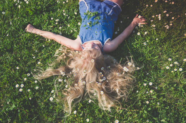 istock girl with long blond hair 1202091721