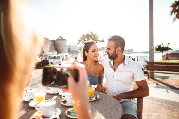 istock couple at the cafe kissing 1202092861