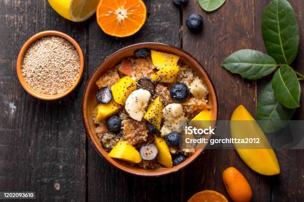 Fresh Quinoa Organic Fruit Salad In Bowl On Wooden Background Helthy Superfood Detox Concept Veganvegetarian Food Space For Text Top View Stock Photo - Download Image Now