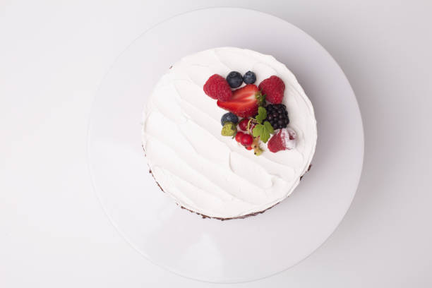 istock close up of conceptual fruit cake on gray background 1202094653
