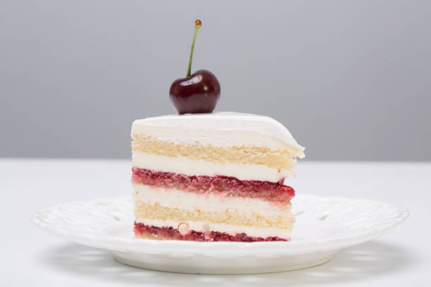 istock close up of conceptual fruit cake on gray background 1202094821