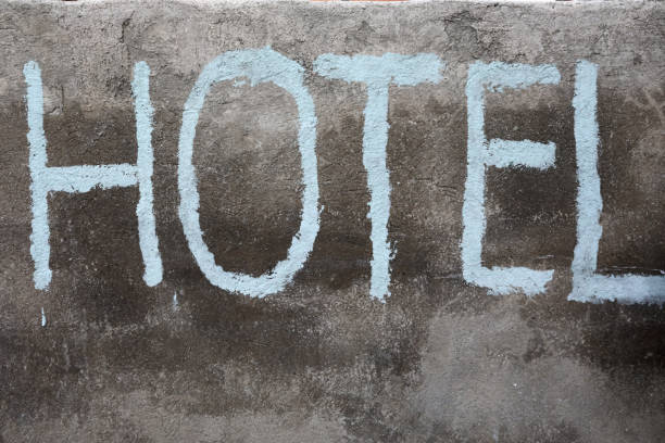 istock Hotel sign on concrete wall 1202096890