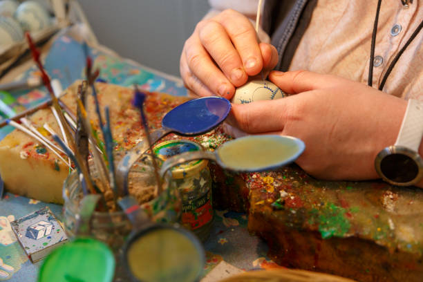 istock Painting and crafting many colorful Sorbian Easter eggs from Germany 1202097253