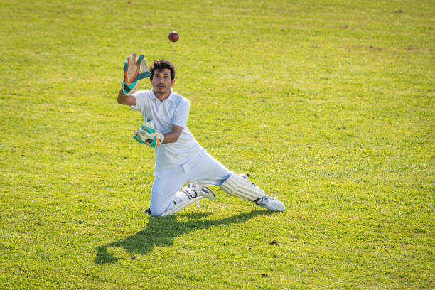 istock Indian cricket player moments before catching the ball 1202097503