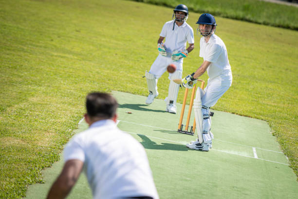 istock Cricket bowler hurling the ball towards the wicket 1202097507