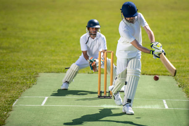 istock Cricket batsman moments after hitting the ball 1202097510