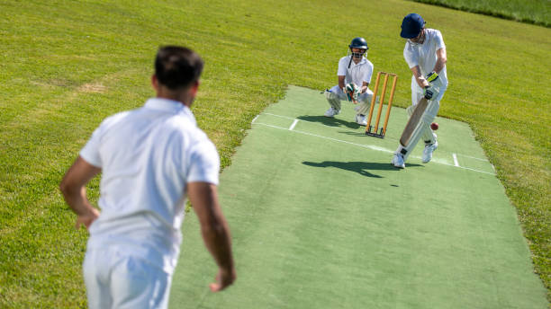 istock Cricket batter hitting the ball 1202097517