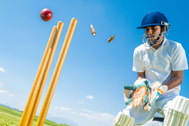 istock Wicket-keeper trying to catch the ball 1202097520