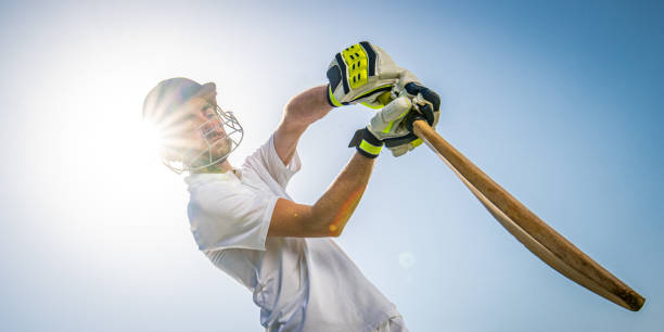 istock Cricket player batting the ball 1202097533