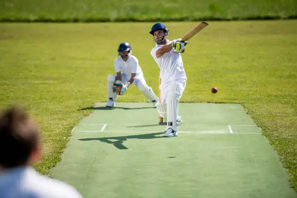 Photo of Cricket batsman moments after hitting the ball