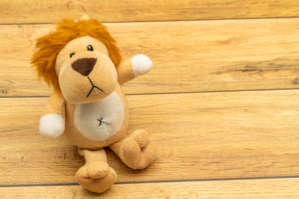 istock Stuffed lion close up, on colorful background. 1202097632