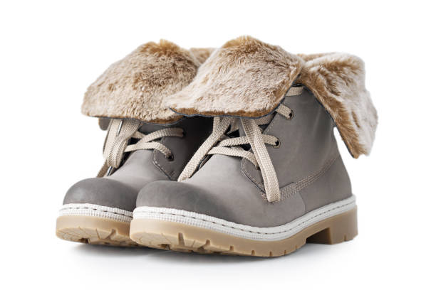 istock Pair of gray leather womens boots on the white background isolated 1202098876